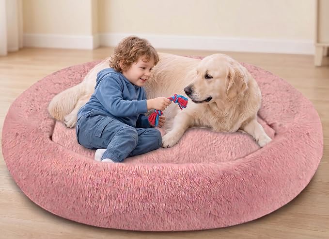 SAVFOX 54 inches Calming Donut Dog Bed - 3X Durable Plush Faux Fur, Machine Washable & Non-Slip, Fits up to 210 lbs, Removable Cover, Pink