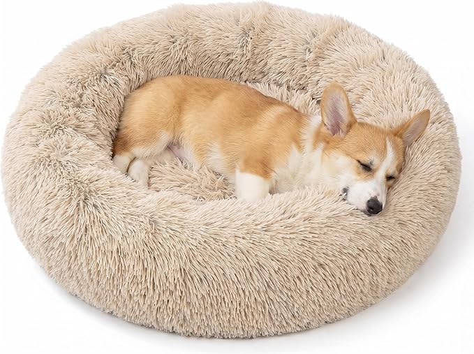 SAVFOX 23 inches Calming Donut Dog Bed - 3X Durable Plush Faux Fur, Machine Washable & Non-Slip, Fits up to 25 lbs, Beige